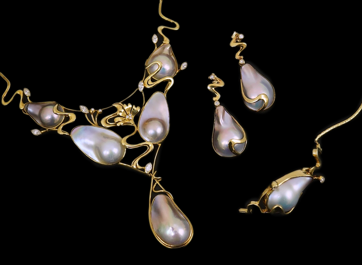 A modern suite of 18k gold, baroque pear, round and marquise diamond set jewellery